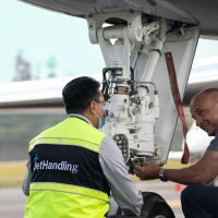 Ground handling team inspecting a private jet during aviation operations