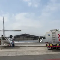 Private jet receiving aviation fuel during ramp refueling service