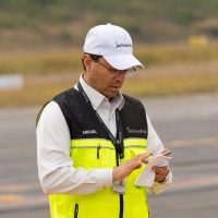 Flight operations team reviewing schedules and aviation documentation for aircraft handling