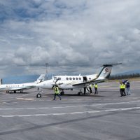 Jethandling ground handling staff coordinating private jet operations on the runway